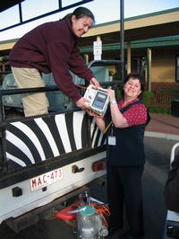 Mercy's Carmela Joyce hands over equipemnet to Natalie, Werribbe Zoo's vet